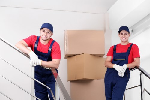 Mover preparing furniture for transport during a Brent house move