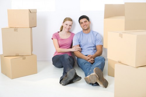 Packed moving boxes and furniture ready for removals in Brent