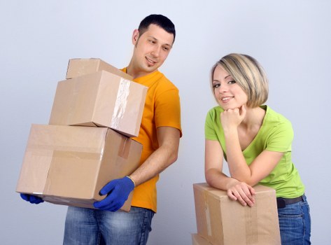 Trained moving staff using careful lifting techniques