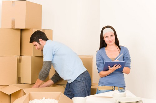 Packed moving boxes ready for a home relocation in Brent
