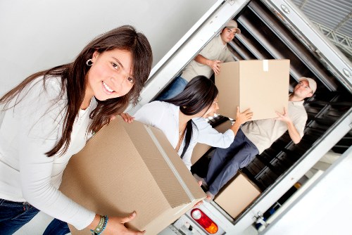 Careful loading of bulky furniture during a Brent pick-up appointment