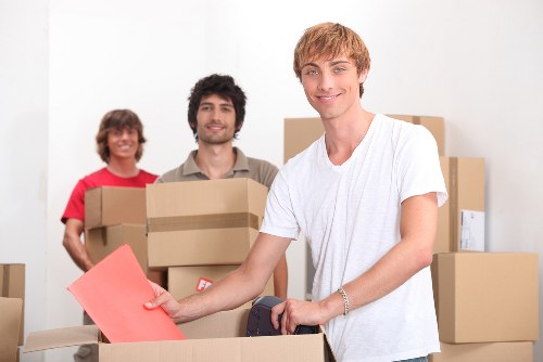 Office move planning with labelled boxes and desks