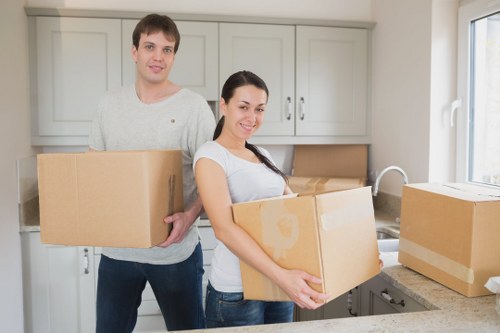 Packed boxes and moving equipment ready for a Brent home move